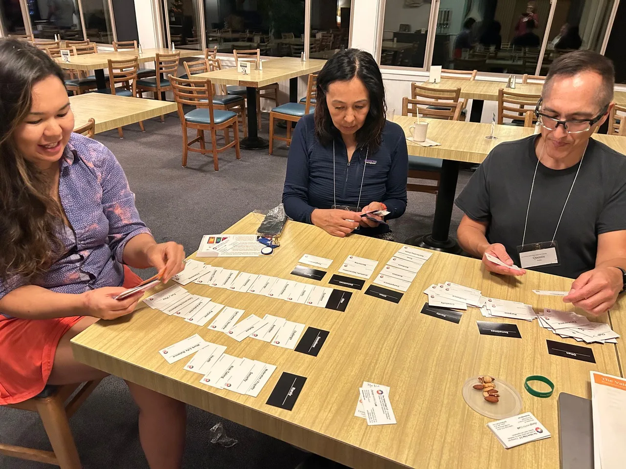 Two people sorting the physical values cards at a table